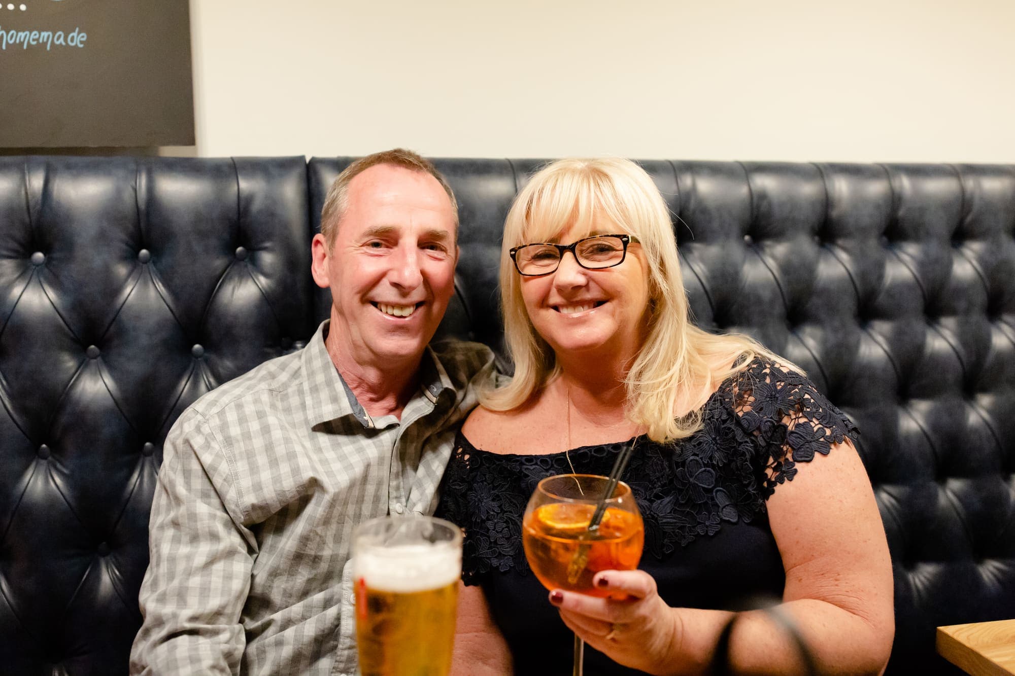 Guests with a pint and a cocktail in the evening