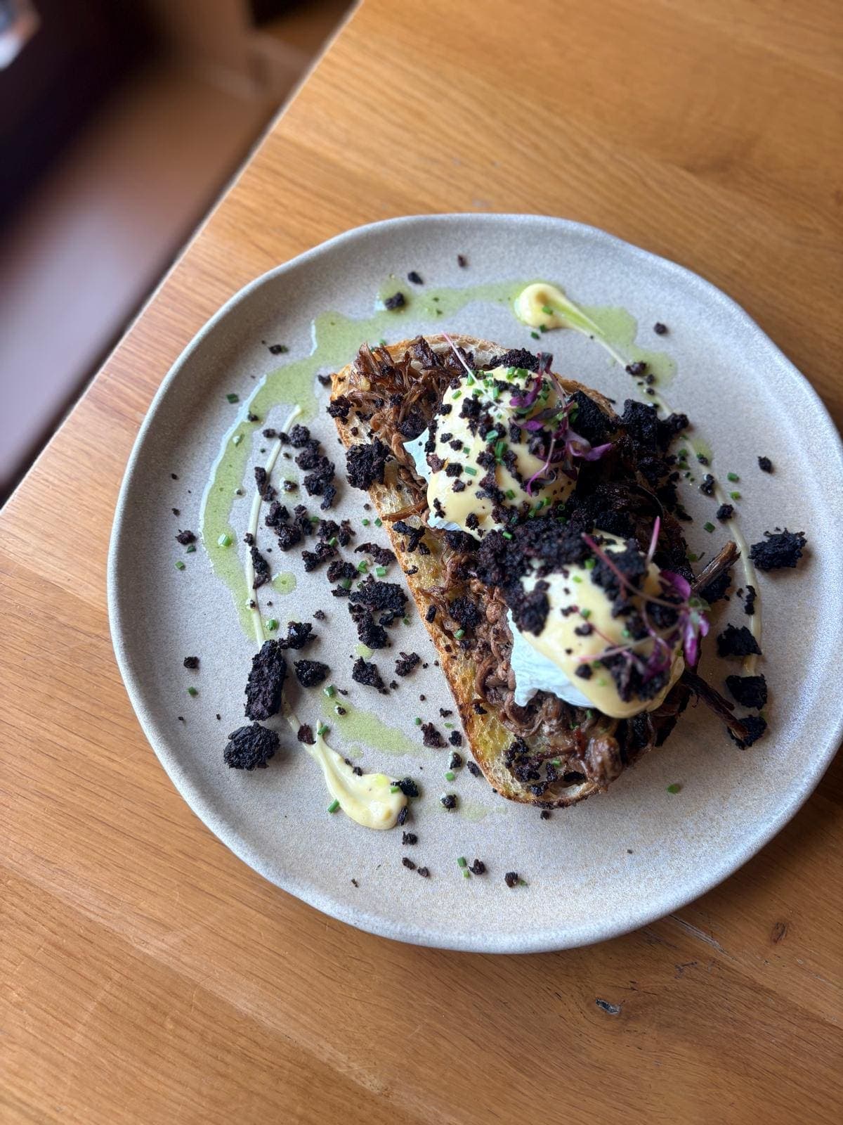 Toasted sourdough topped with black pudding, poached egg and hollandaise